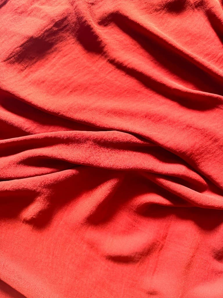 Burnt Orange scarf — soft folds in warm light