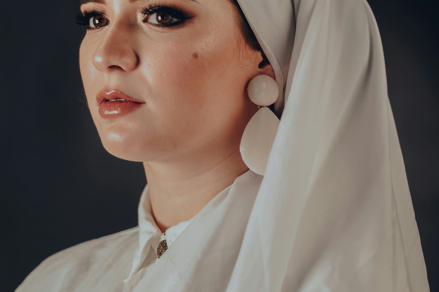 Woman in a soft grey hijab representing Zaheen’s vision